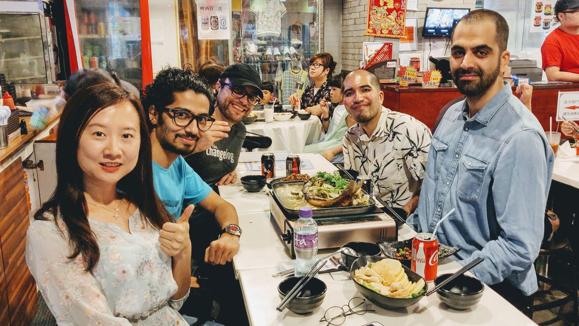 Some members of the freeCodeCamp team enjoying a meal during a meetup in Hong Kong.