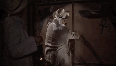 A gif of a man opening door